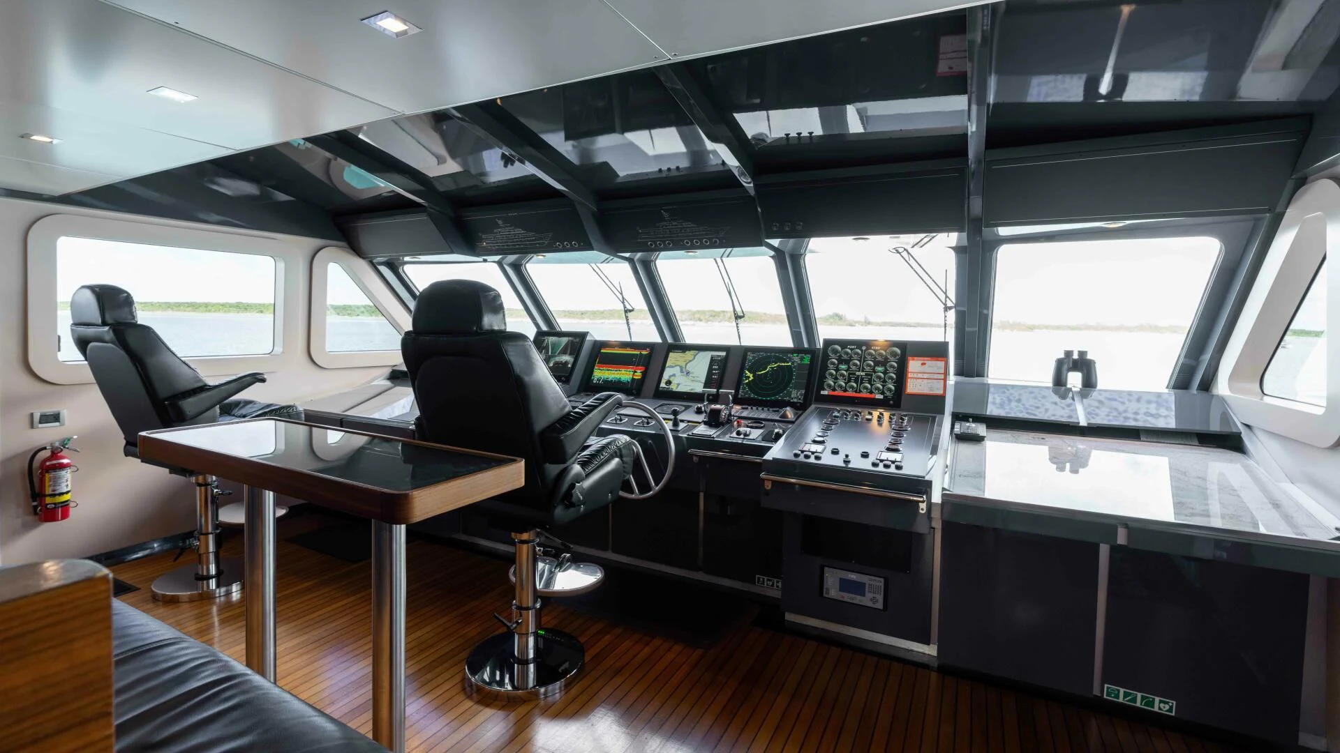 a room with a table and chairs aboard SEA AXIS Yacht for Charter