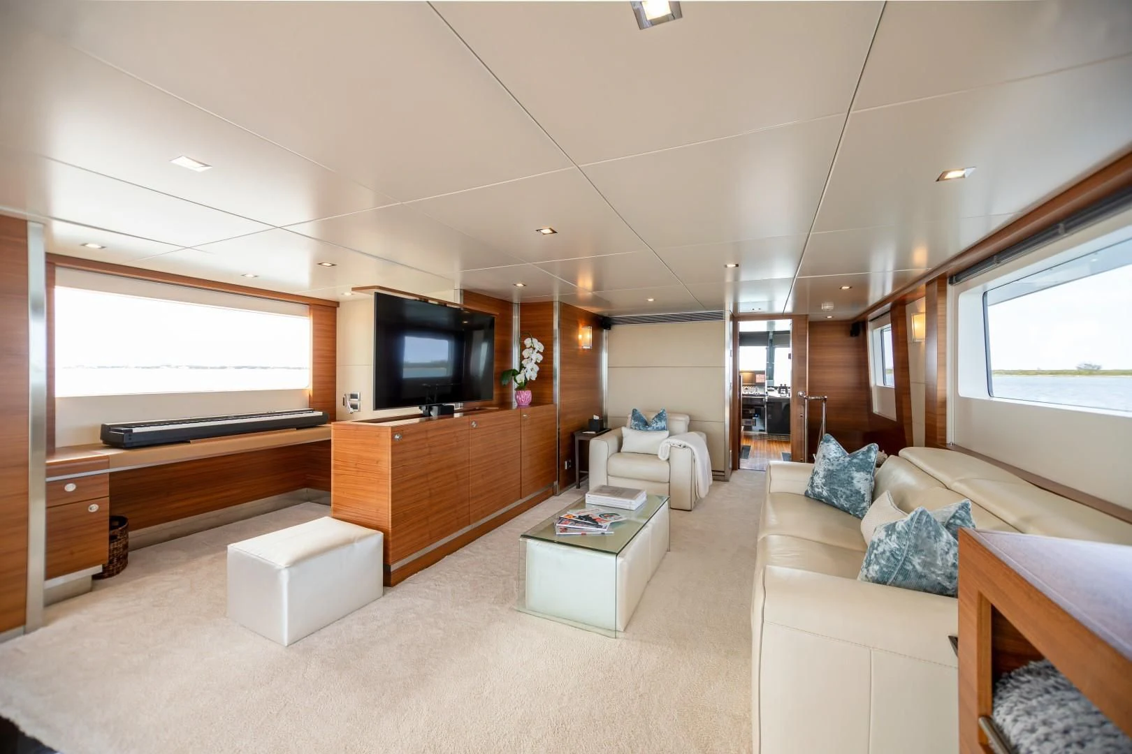 a living room with a large window aboard SEA AXIS Yacht for Charter