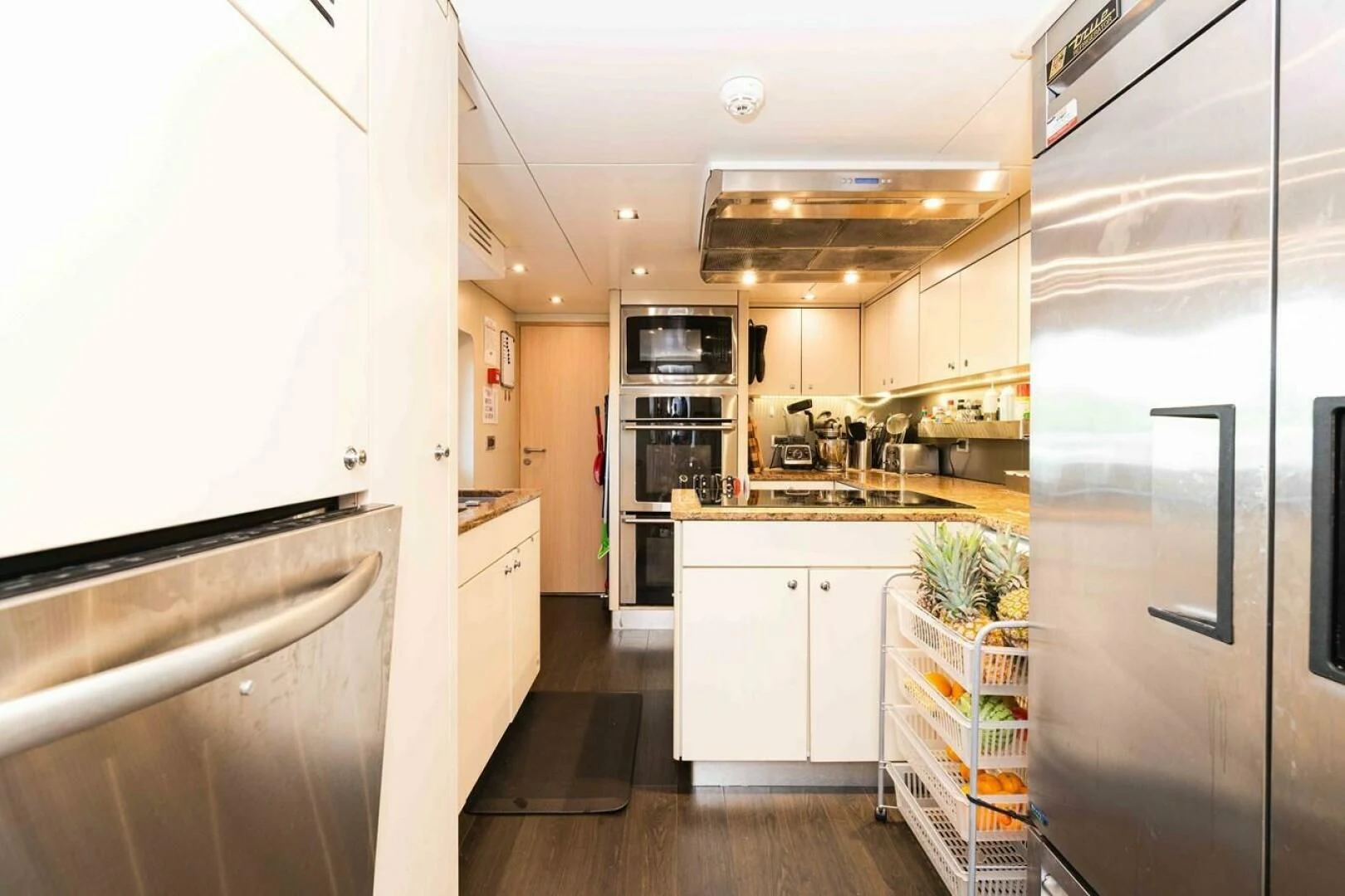 a kitchen with a large island aboard SEA AXIS Yacht for Charter
