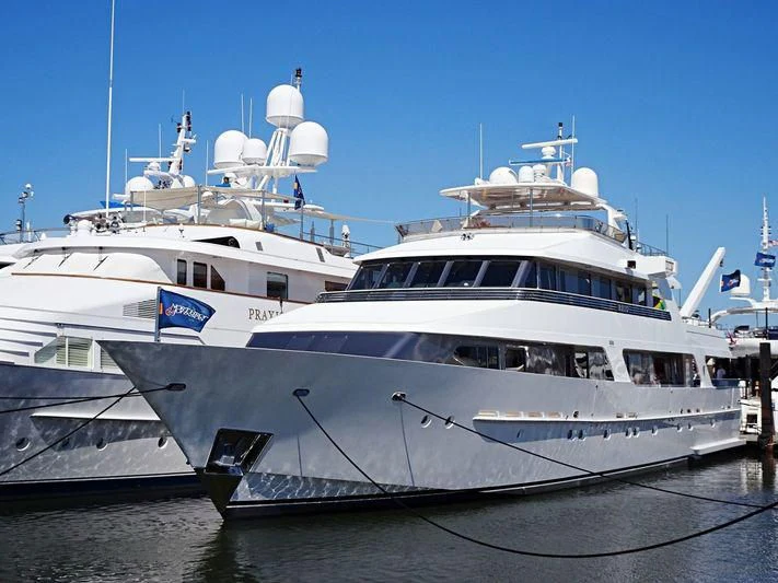 a couple of large white yachts aboard SEA AXIS Yacht for Charter