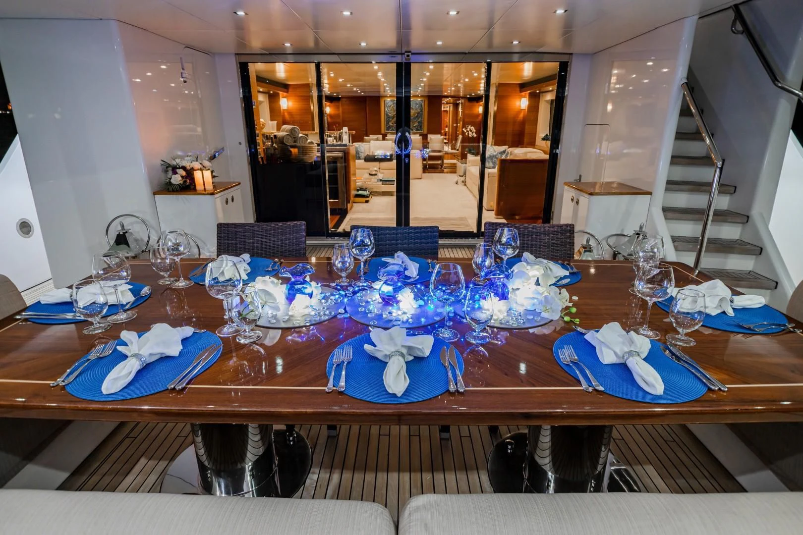 a table with many blue and white items on it aboard SEA AXIS Yacht for Charter