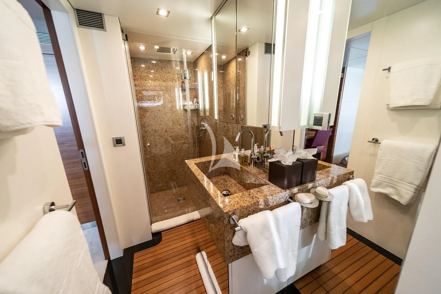 a bathroom with a sink and a mirror aboard SEA AXIS Yacht for Charter
