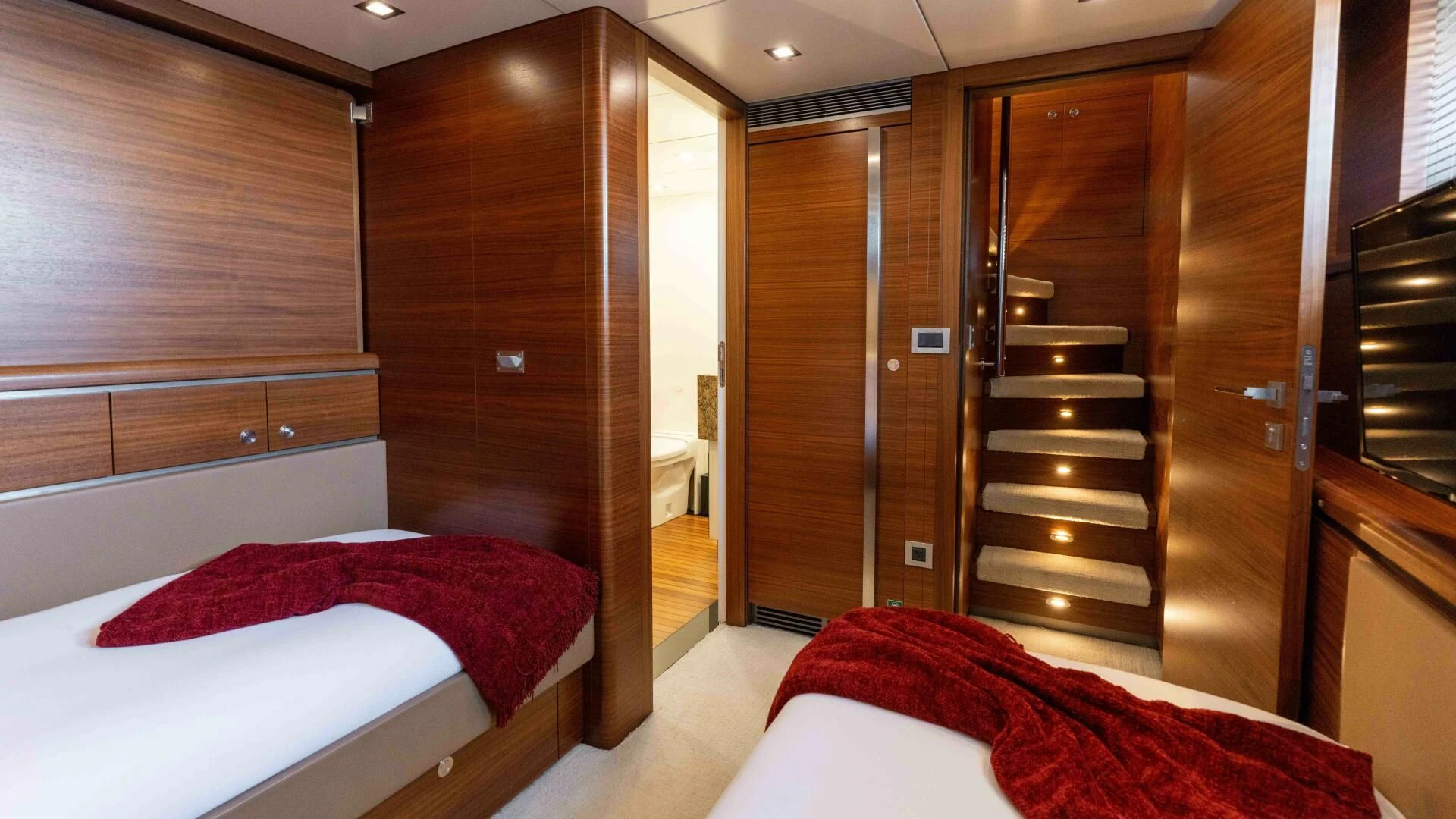 a room with a bed and a closet aboard SEA AXIS Yacht for Charter