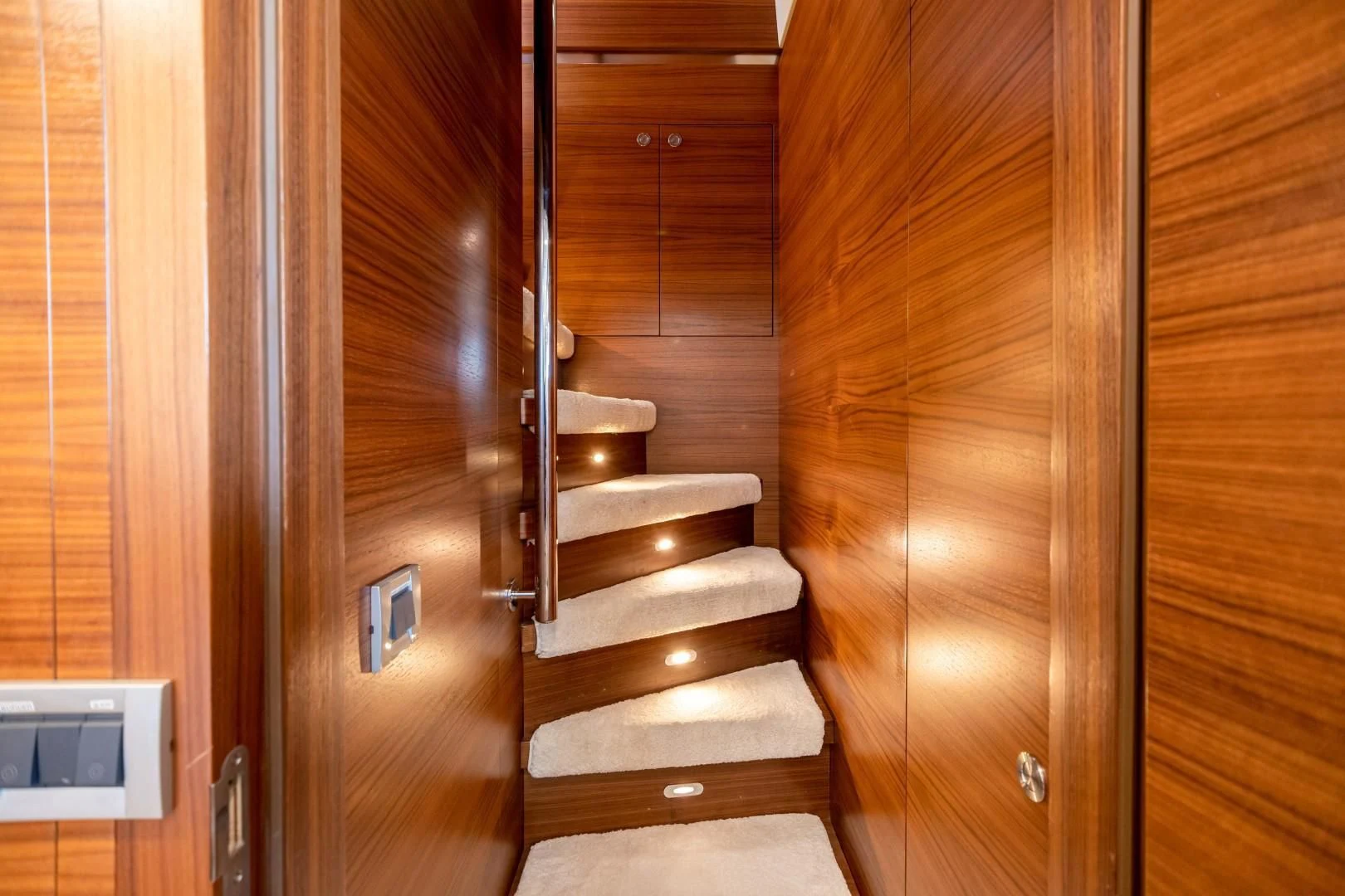 a wooden staircase in a room aboard SEA AXIS Yacht for Charter
