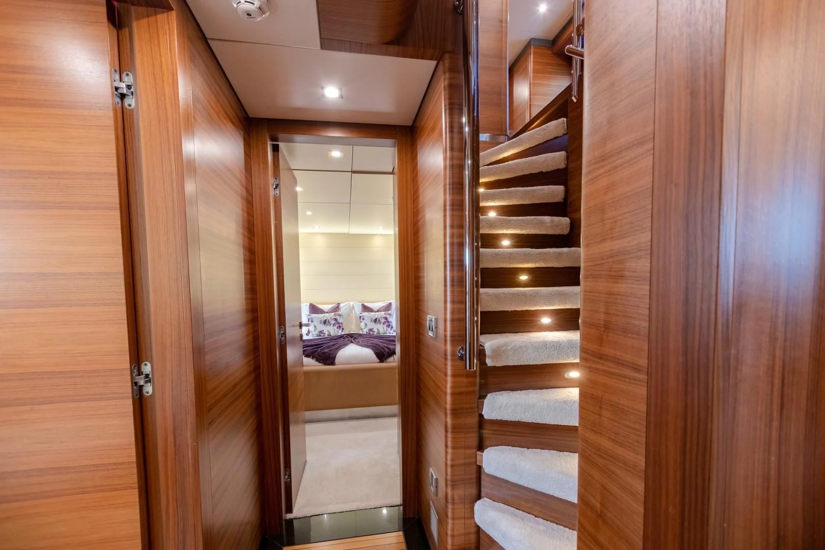 a wooden closet with a bed aboard SEA AXIS Yacht for Charter