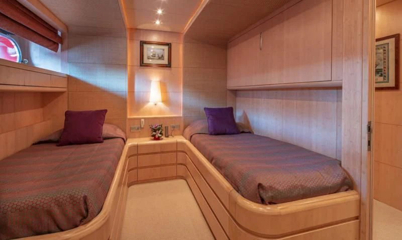 a room with two beds aboard GLAROS Yacht for Sale