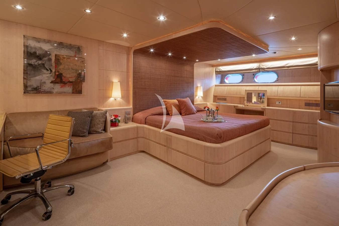 a room with a bed and a chair aboard GLAROS Yacht for Sale