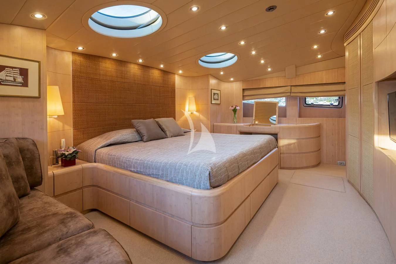 a large bed in a room aboard GLAROS Yacht for Sale