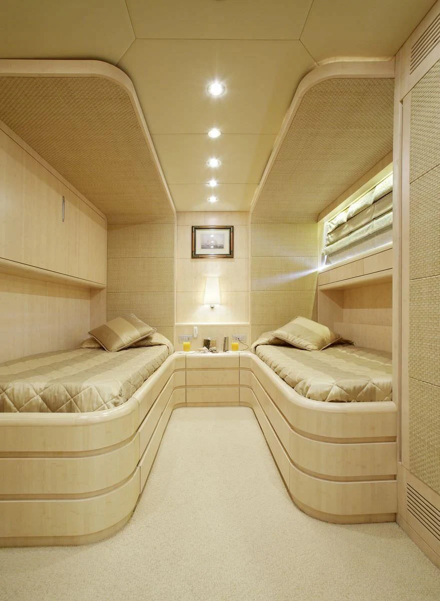 a room with a couple of beds aboard GLAROS Yacht for Sale