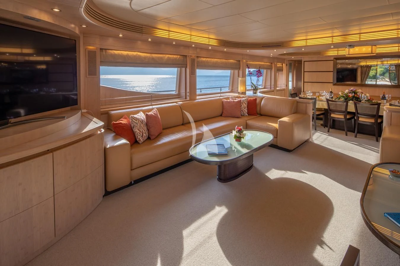 a living room with a couch and a coffee table aboard GLAROS Yacht for Sale