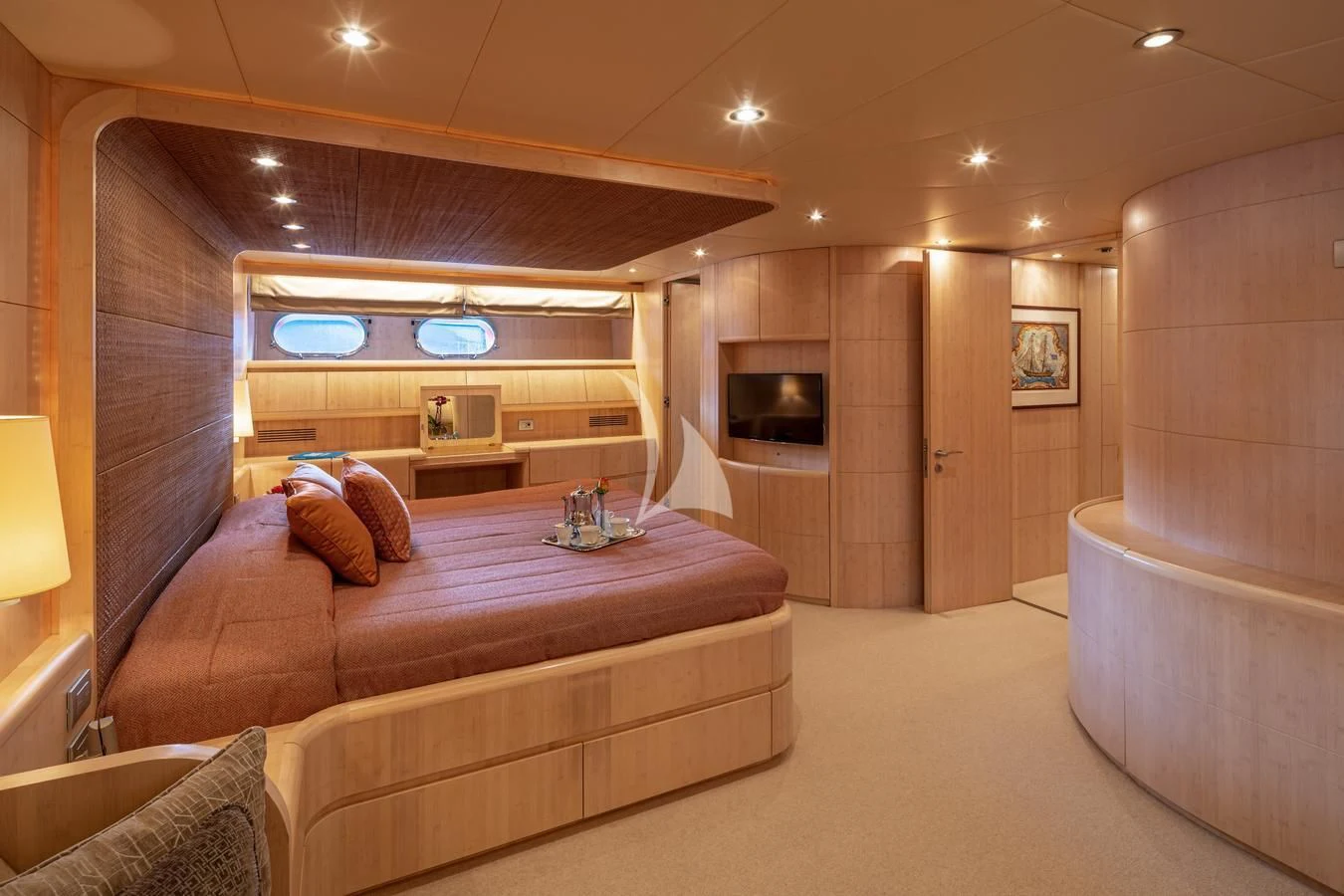 a bedroom with a bed and a television aboard GLAROS Yacht for Sale
