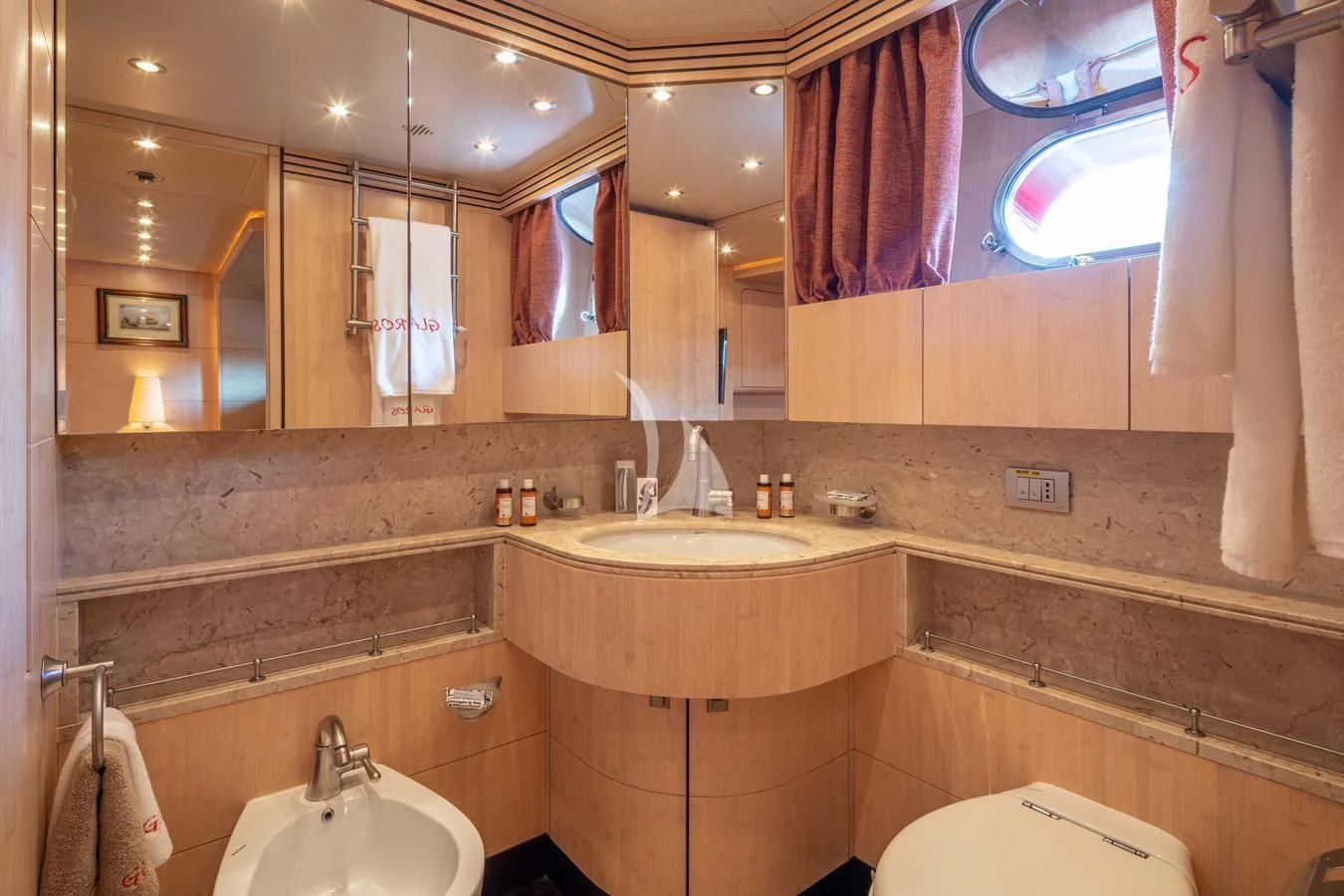 a bathroom with a sink and a toilet aboard GLAROS Yacht for Sale