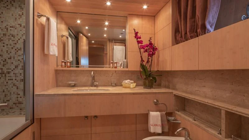 a bathroom with a large mirror aboard GLAROS Yacht for Sale