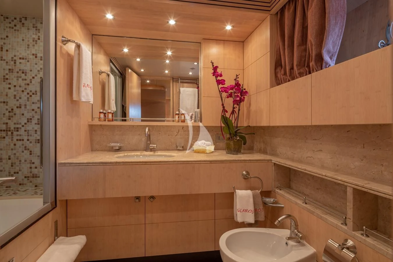 a bathroom with a large mirror aboard GLAROS Yacht for Sale