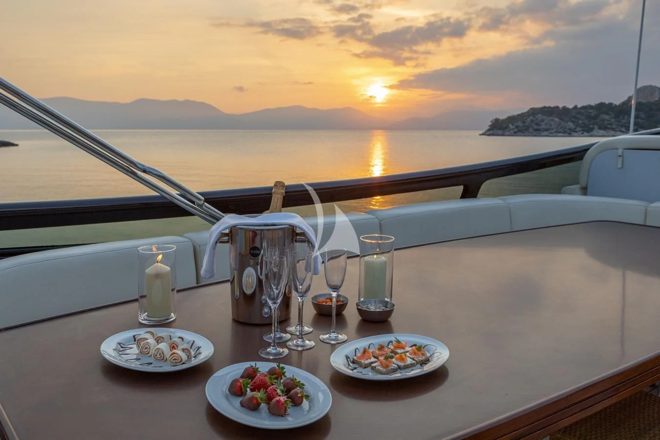 a table with plates and glasses on it aboard GLAROS Yacht for Sale