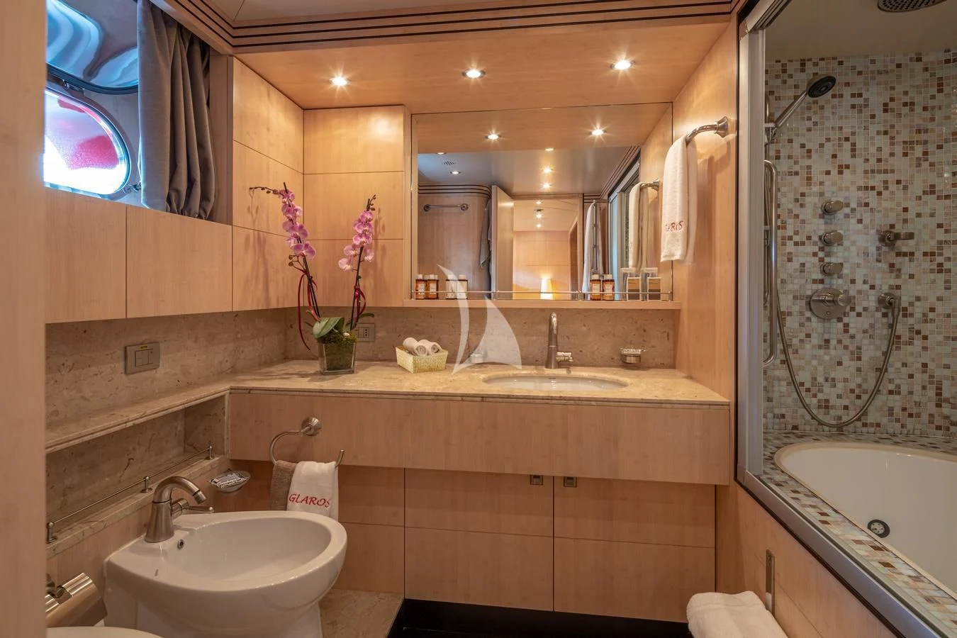 a bathroom with a large mirror aboard GLAROS Yacht for Sale