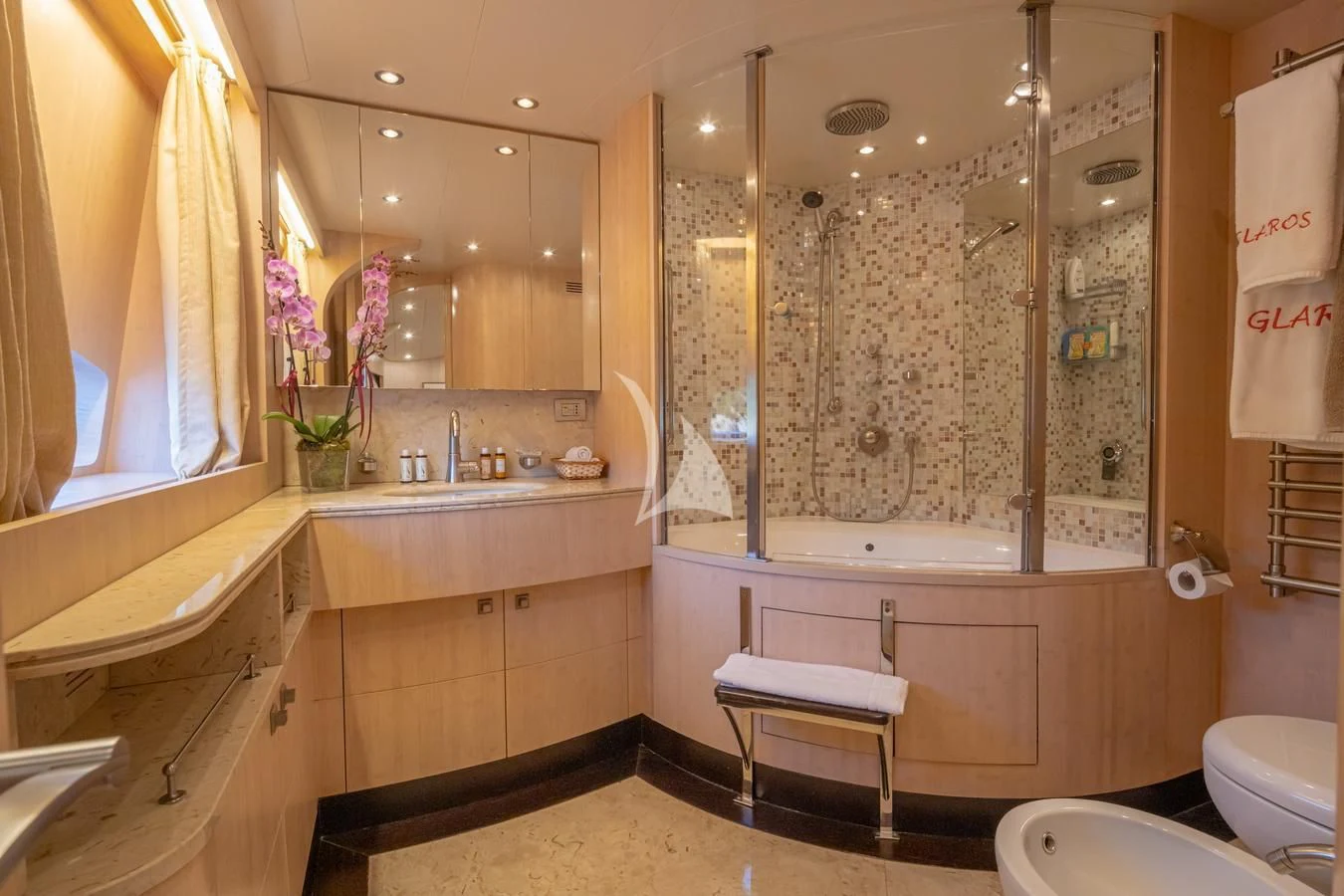a bathroom with a large mirror aboard GLAROS Yacht for Sale