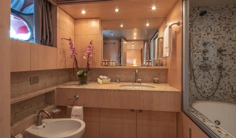 a bathroom with a large mirror aboard GLAROS Yacht for Sale