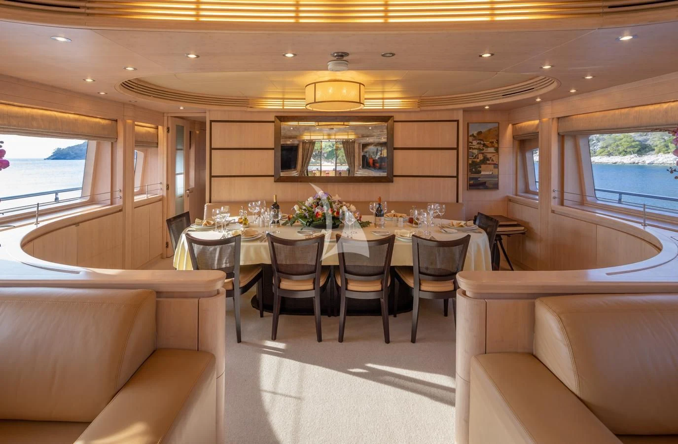 a dining room with a table and chairs aboard GLAROS Yacht for Sale