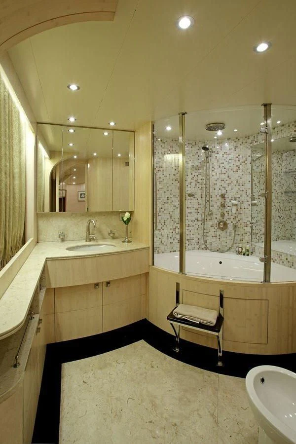 a bathroom with a tub sink and a sink aboard GLAROS Yacht for Sale