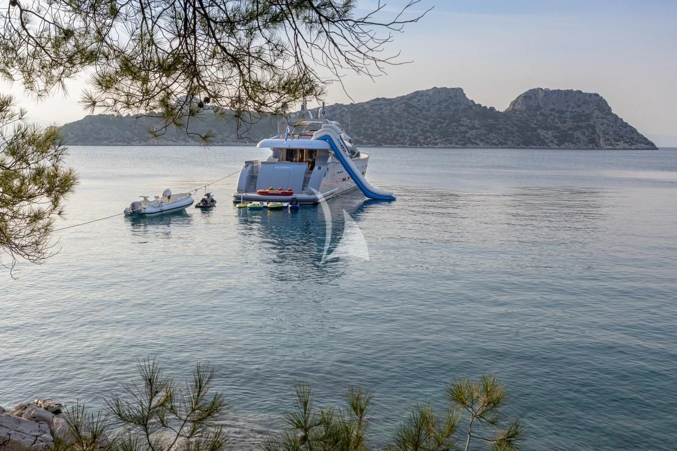 a couple of boats on the water aboard GLAROS Yacht for Sale