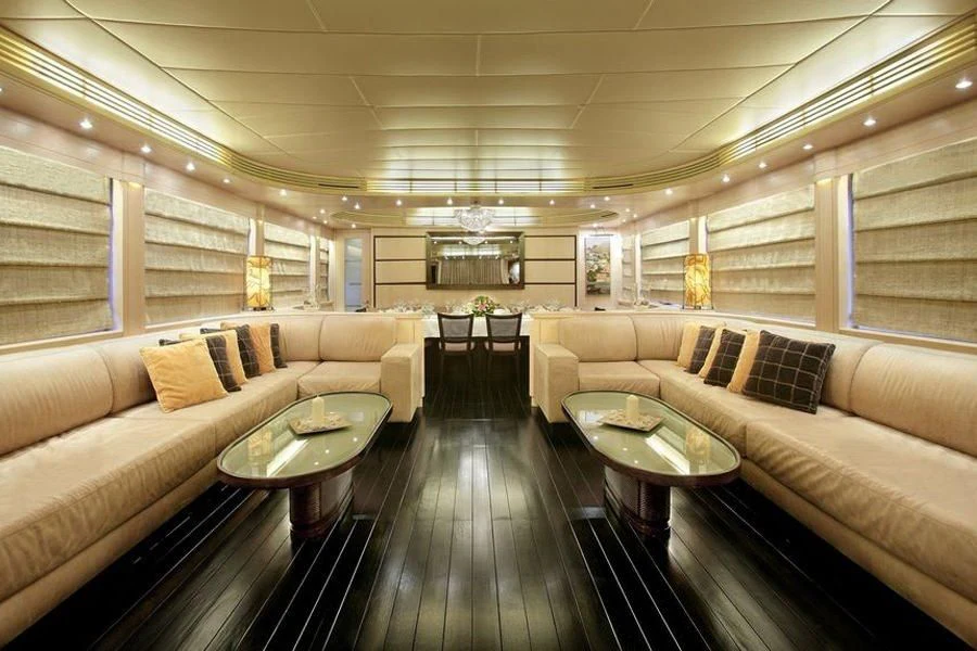 a living room with a wood floor aboard GLAROS Yacht for Sale