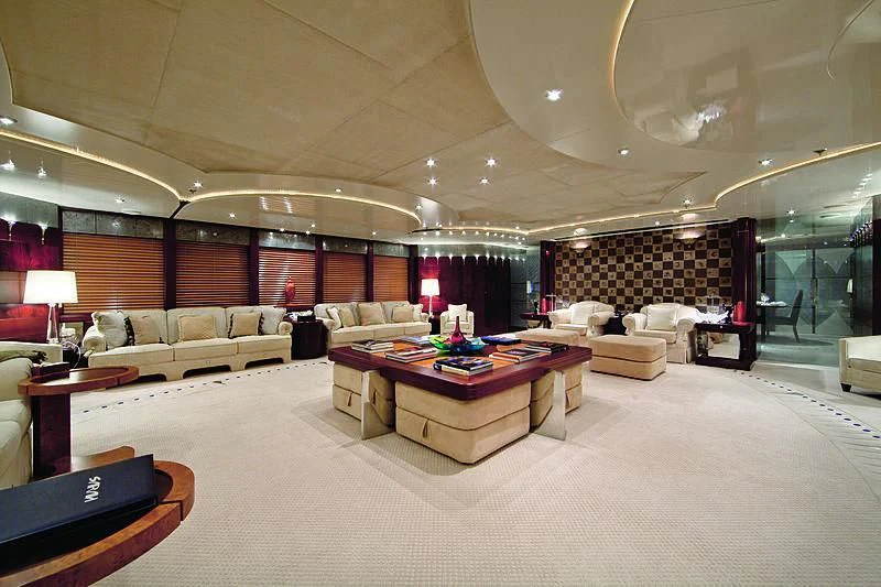 a large living room with a large chandelier aboard SARAH Yacht for Sale