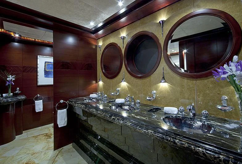 a fancy bathroom with a large mirror aboard SARAH Yacht for Sale