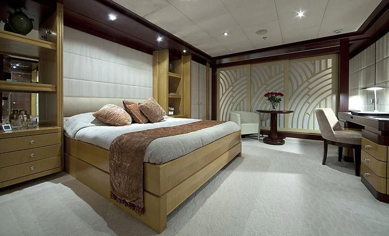 a large bedroom with a bed and a desk aboard SARAH Yacht for Sale