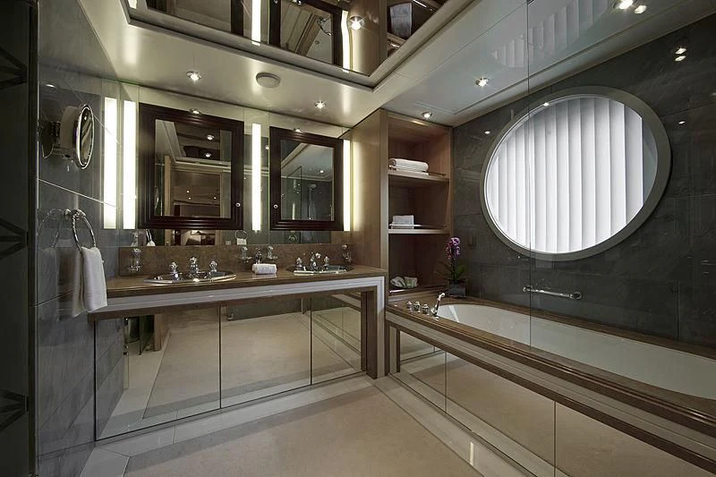 a bathroom with a large mirror aboard SARAH Yacht for Sale