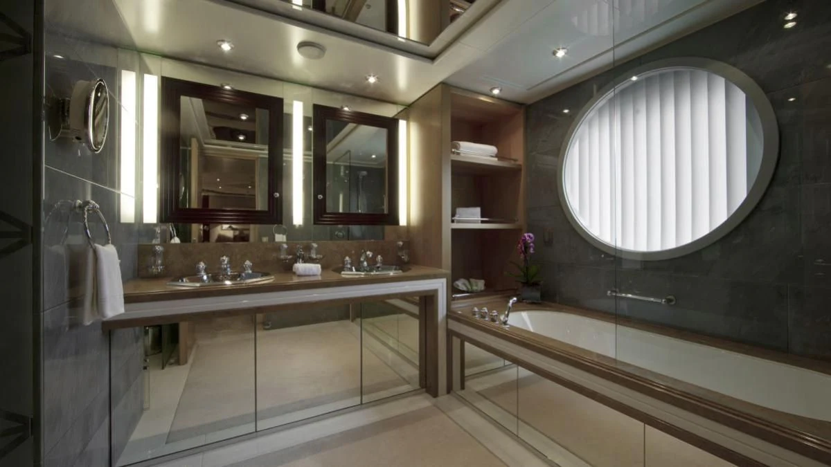 a bathroom with a large mirror aboard SARAH Yacht for Sale