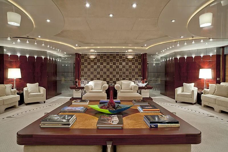 a large living room with a large table and chairs aboard SARAH Yacht for Sale
