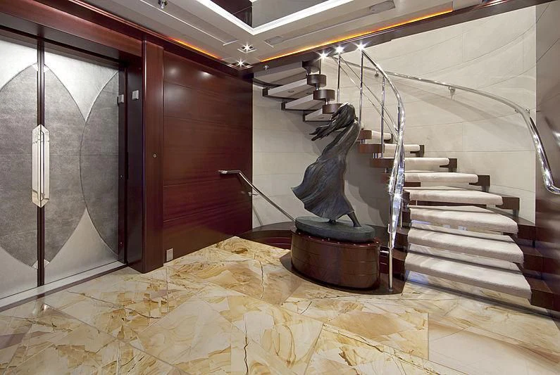 a room with stairs and a fireplace aboard SARAH Yacht for Sale