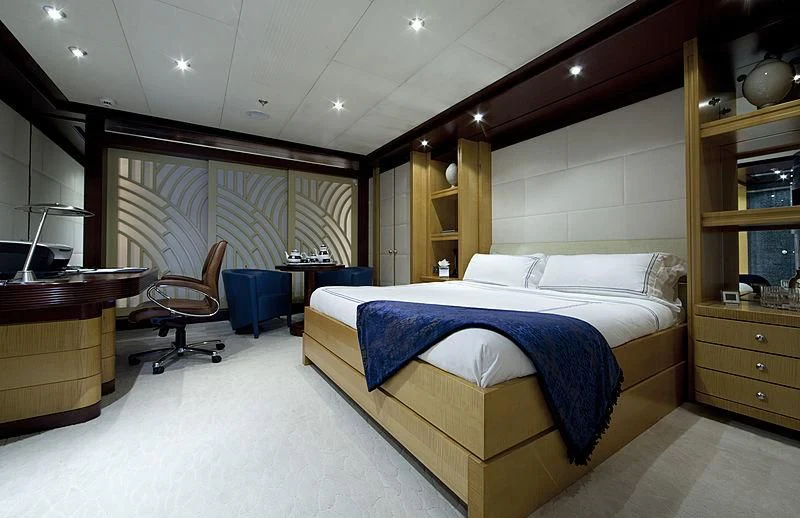 a bedroom with a bed and a desk aboard SARAH Yacht for Sale