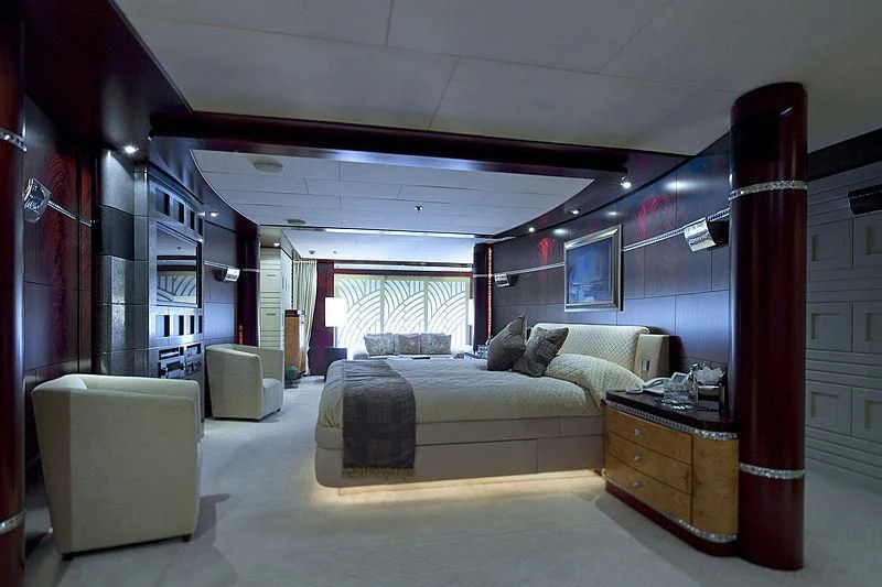 a bedroom with a bed and a desk aboard SARAH Yacht for Sale