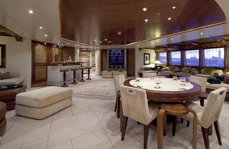 a large living room with a large table and chairs aboard SARAH Yacht for Sale
