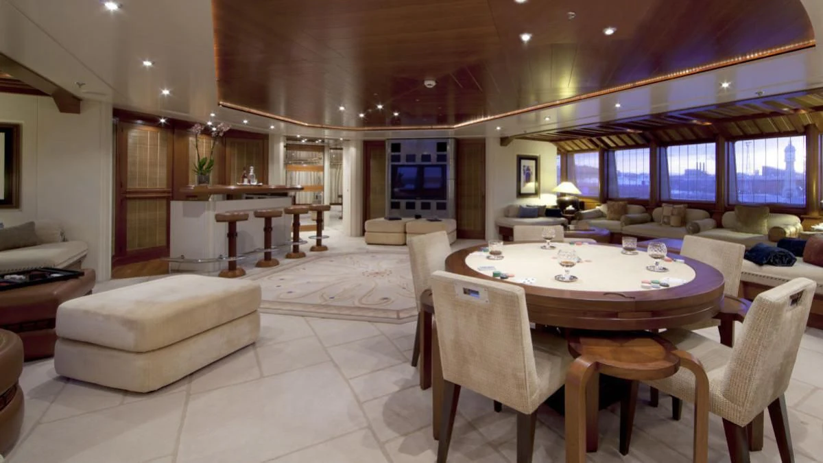 a large room with a table and chairs aboard SARAH Yacht for Sale
