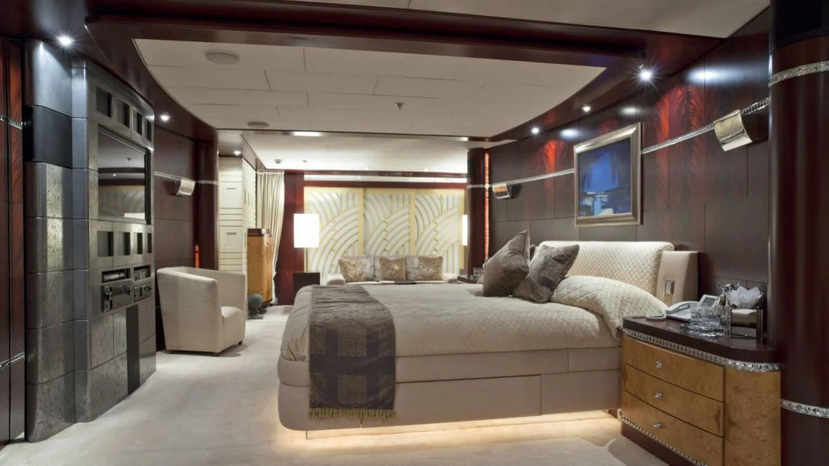 a bedroom with a bed and a desk aboard SARAH Yacht for Sale