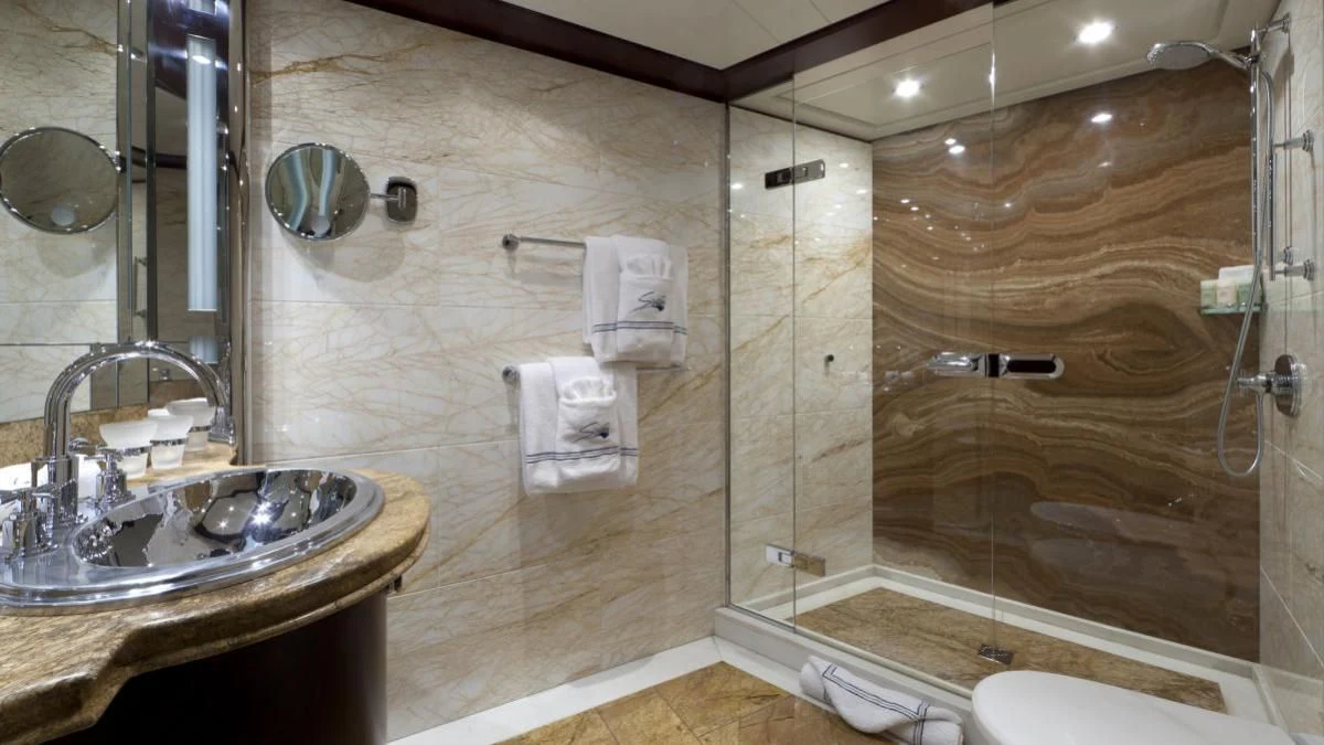 a bathroom with a glass shower aboard SARAH Yacht for Sale
