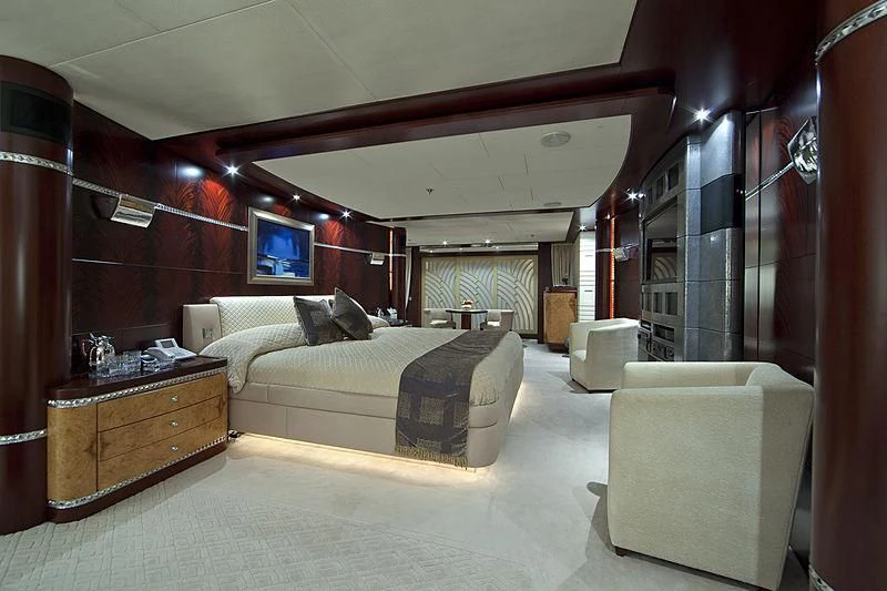a room with a bed and a chair aboard SARAH Yacht for Sale