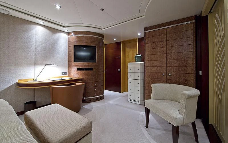 a room with a tv and a table aboard SARAH Yacht for Sale