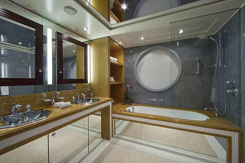 a bathroom with a large mirror aboard SARAH Yacht for Sale