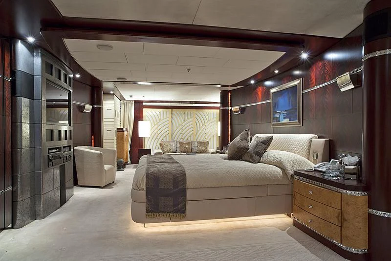 a bedroom with a bed and a desk aboard SARAH Yacht for Sale