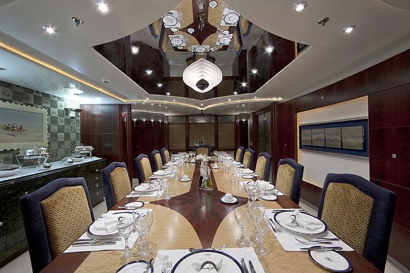 a dining room with a table set aboard SARAH Yacht for Sale