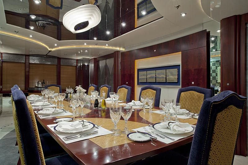 a dining room with a table set aboard SARAH Yacht for Sale