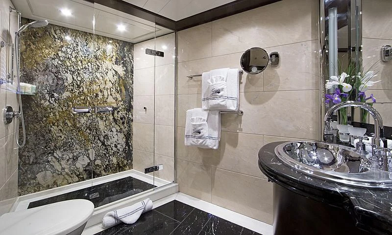 a bathroom with a glass shower aboard SARAH Yacht for Sale