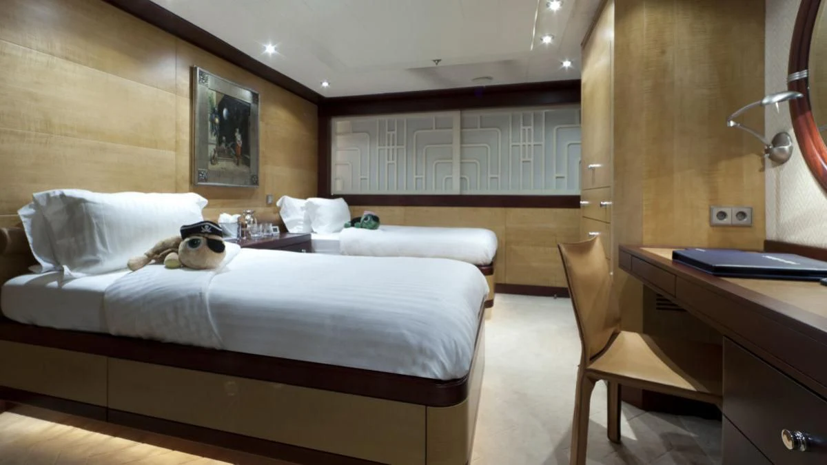 a cat lying on a bed aboard SARAH Yacht for Sale