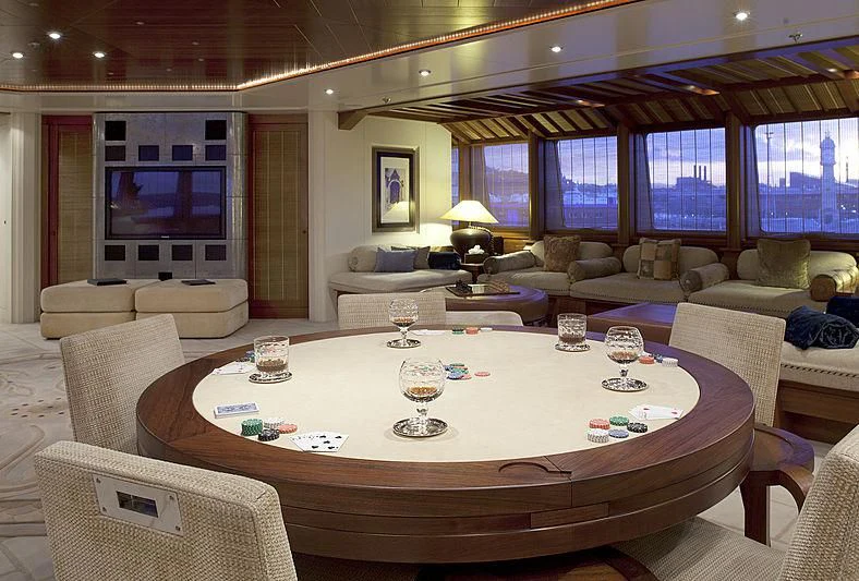 a large living room with a large table and chairs aboard SARAH Yacht for Sale