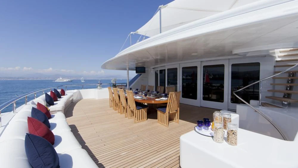 a large white tent with a table and chairs on it aboard SARAH Yacht for Sale