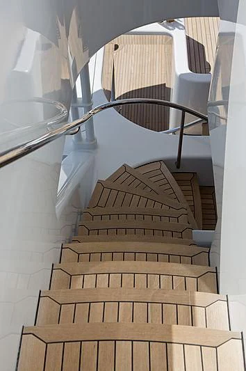 a staircase with a spiral staircase aboard SARAH Yacht for Sale